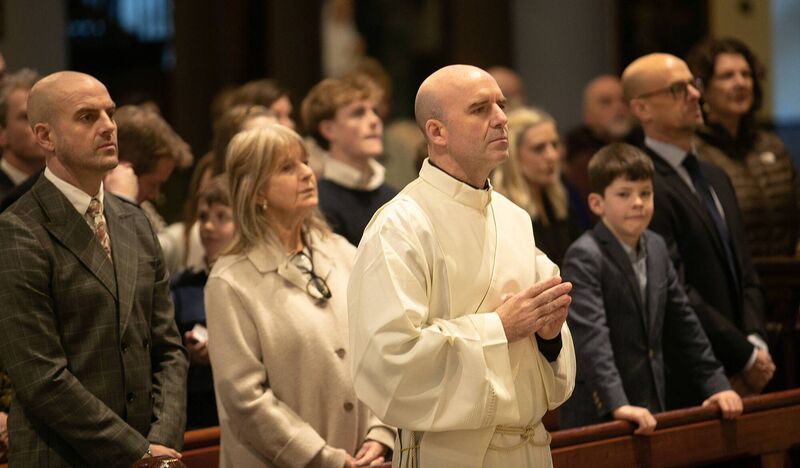 Fr Stuart McGovern with members of his family including his mum, Yvonne, and three siblings during his ordination late last month. Picture: John Power