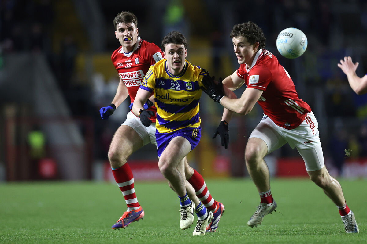 Roscommon's Ben O’Carroll and Neil Lordan of Cork tussle for the ball. Picture: INPHO/Bryan Keane