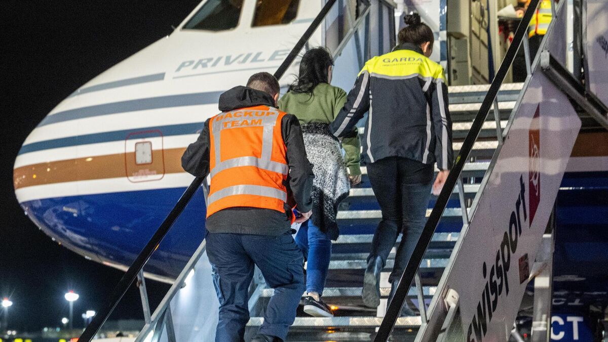 Deportees are escorted from Garda vehicles to a charter aircraft during Operation Trench for one of the high-profile deportation flights as the topic of immigration mushroomed throughout 2025. Picture: Chani Anderson