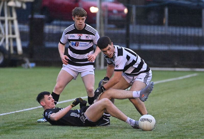  St Nick's players Rhys Dunne and Michael Gayfor get the better of Cian Buckley, Donoughmore. Picture: Dan Linehan