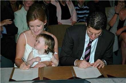 Joanna Donnelly and Harm Luijkx with their daughter at their wedding in Amsterdam.