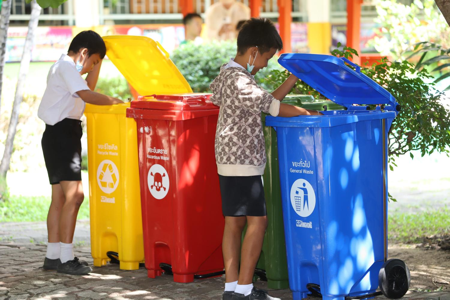 Students at a school in Bangkok are encouraged to separate garbage for recycling. Varuth Hirunyatheb