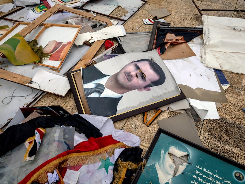 Defaced portraits of ousted Syrian president Bashar al-Assad outside a municipal building in Aleppo, Syria, following the collapse of his regime in December 2024. Photograph: Ivor Prickett/The New York Times
                      
