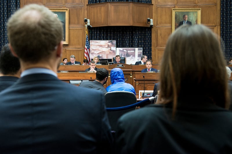 A Syrian army police photographer defector known as 'Caesar' (blue jacket) at the hearings on Capitol Hill in 2014. Photograph: Brendan Smialowski/AFP via Getty Images