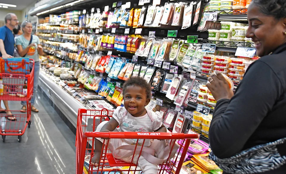 Ashley Phipps and her 10-month-old daughter Abigail at opening day for Brevard County’s first Trader Joe’s, located at 2221 Town Center Ave. at the Avenue Viera.