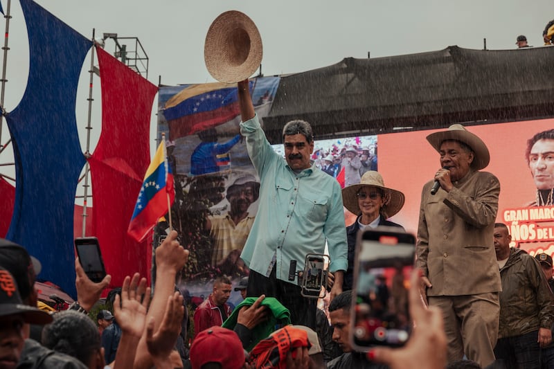 Venezuelan president Nicolás Maduro waves to a crowd during a rally in Caracas on Wednesday. Photograph: Alejandro Cegarra/New York Times
                      