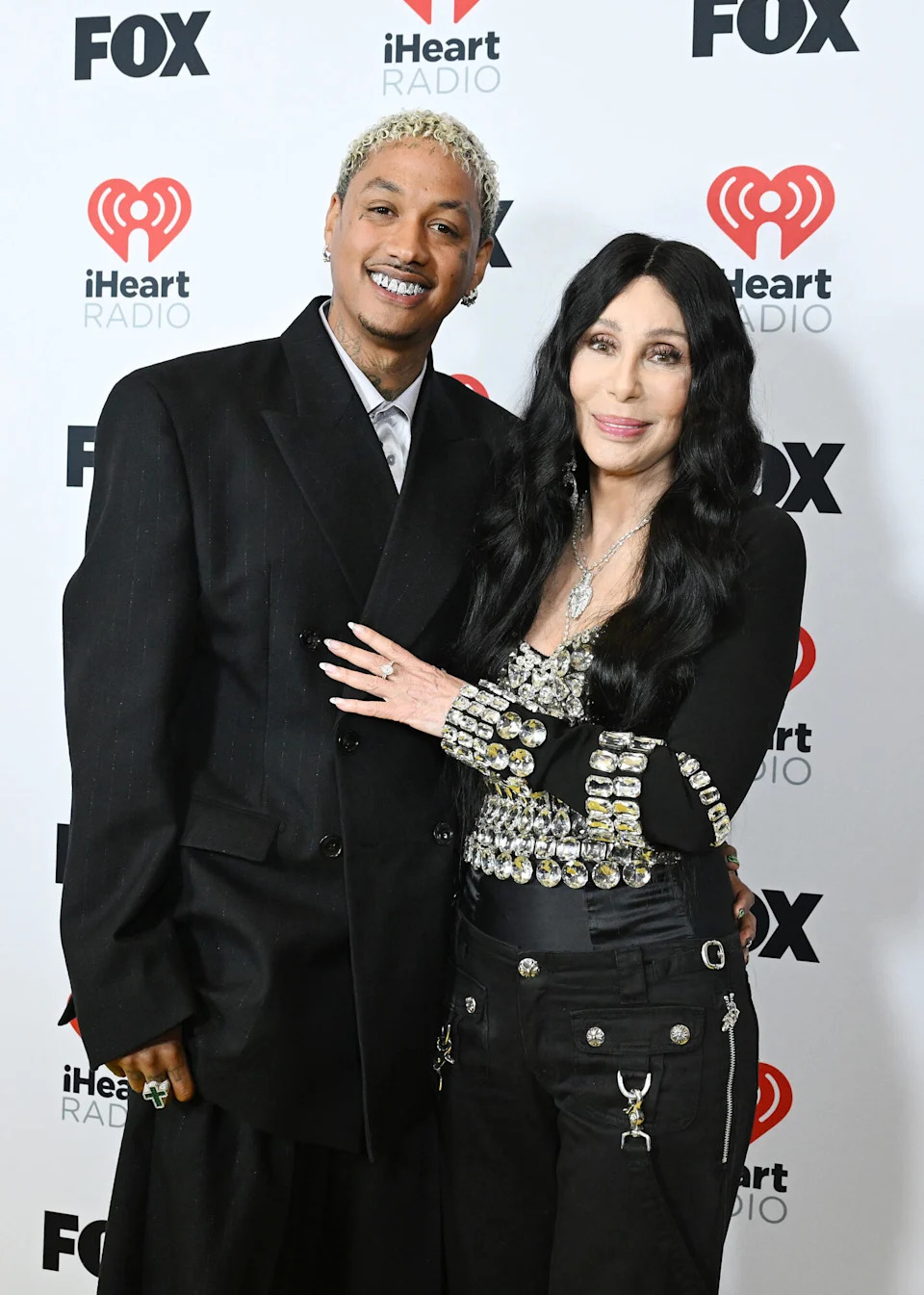 Alexander "AE" Edwards and Cher, winners of the Icon award, pose in the press room at the 2024 iHeartRadio Music Awards held at the Dolby Theatre on April 1, 2024 in Los Angeles, Calif.