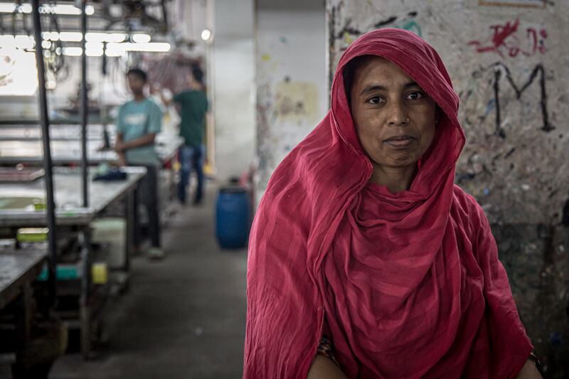 Jharna (39) works to support her children through education, but her daughters say they miss her and want her to leave the garment industry
