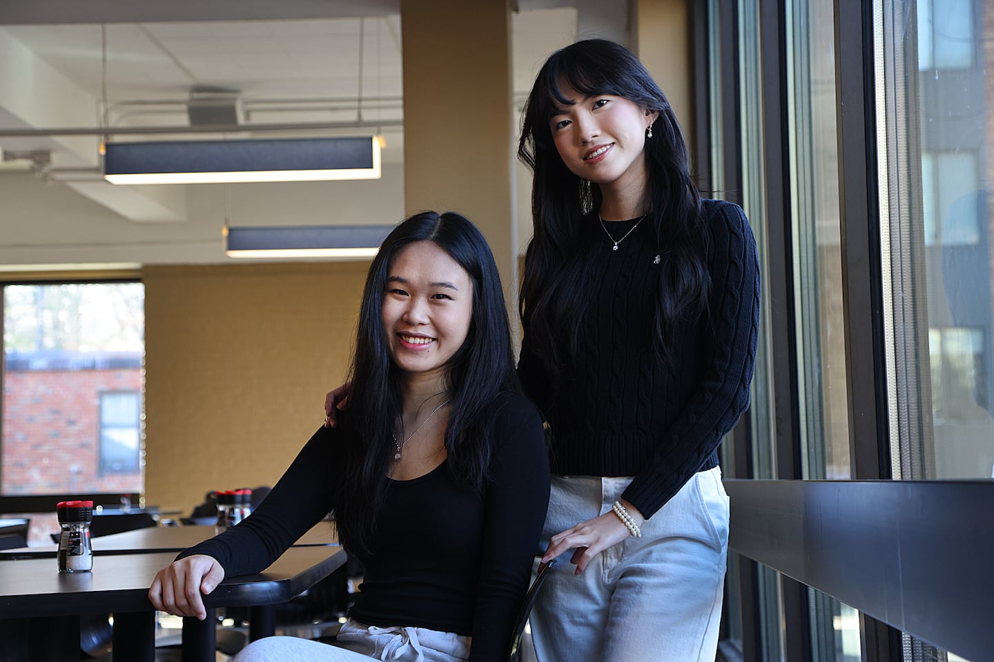 Brandeis University students Sherren Jie, left, and Ivy Tran are two of the creators of the Strangers app, which matches students based on their interests for a shared meal.
