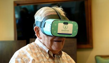 Jim Holtshouse watches video through a Rendever virtual-reality headset at the Forum at Rancho San Antonio retirement community