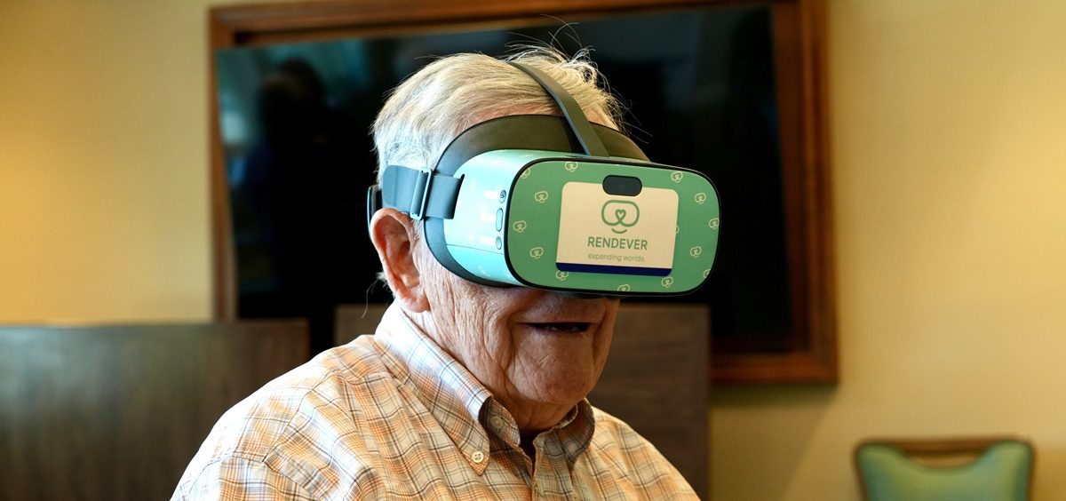 Jim Holtshouse watches video through a Rendever virtual-reality headset at the Forum at Rancho San Antonio retirement community