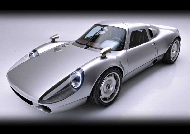 A silver, retro-styled sports car with rounded headlights, wide tires, and a sleek, aerodynamic body—one of the 20 Cars That Focused on Analog Engagement in 2025—viewed from the front-left angle.