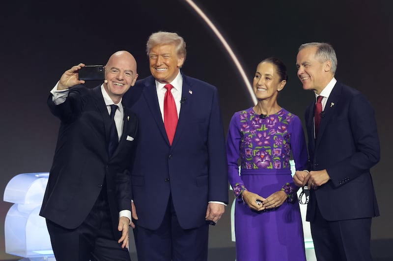 US president Donald Trump, Mexico president Claudia Sheinbaum and Canadian prime minister Mark Carney pose for a selfie with Gianni Infantino, president of FIFA. Photograph: Kevin Dietsch/ Getty Images