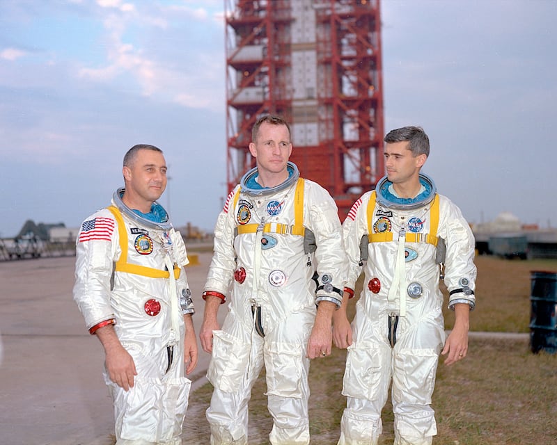 Gus Grissom, Ed White and Roger Chaffee in front of Launch Complex 34, housing the Saturn 1 launch vehicle. Photograph: Nasa