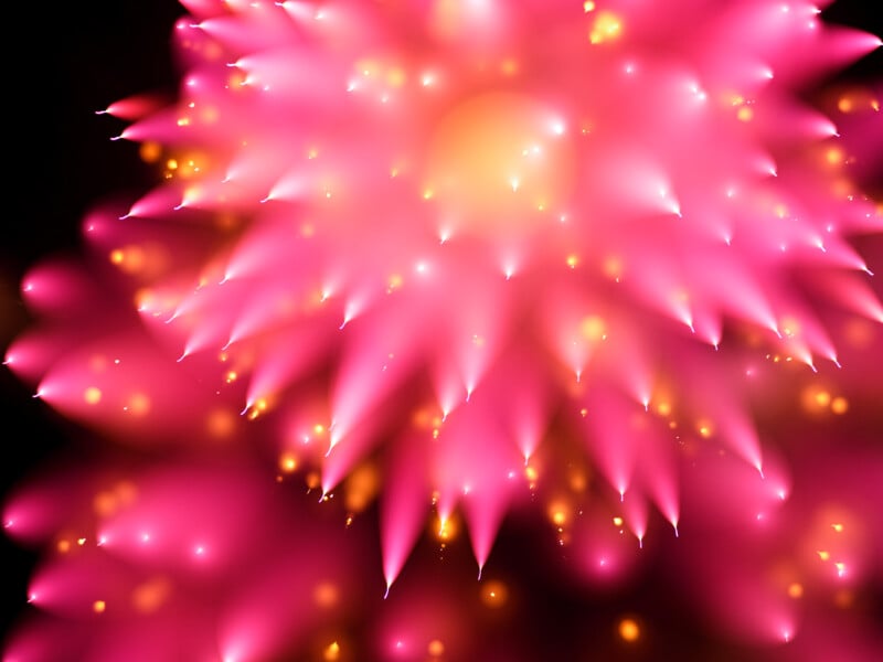 Abstract image featuring layered, glowing pink shapes resembling flower petals, with bright yellow and orange light spots scattered throughout, set against a dark background.
