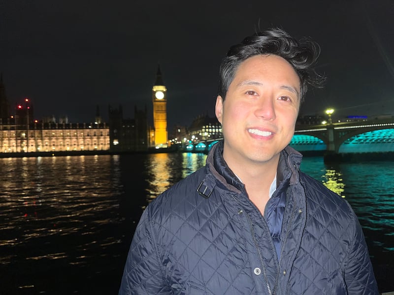 Ryan Williams, an online influencer who is known for his criticisms of Islam, standing at the river Thames as Robinson's associates tried to project on to the Houses of Parliament. Photograph: Mark Paul