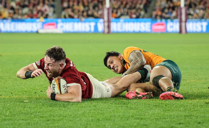 Hugo Keenan celebrates crossing the Australian line to score a try and write himself into British and Irish Lions history. Photograph: Dan Sheridan/Inpho
