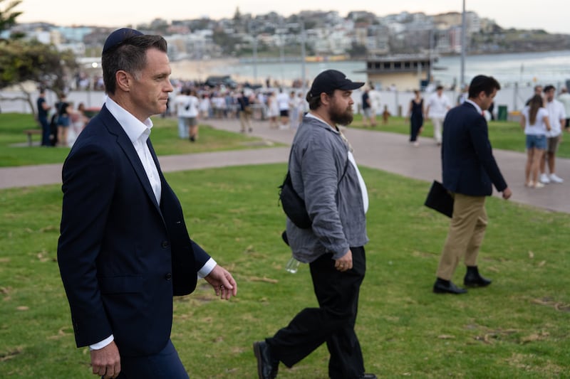 New South Wales premier Chris Minns (left) arrives at the vigil. Photograph: Audrey Richardson/Getty