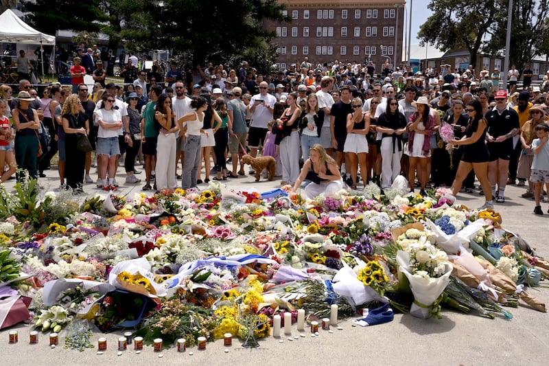 Mourners gather by floral tributes at the Bondi Pavillion in memory of the victims of a shooting at Bondi Beach, in Sydney on December 15th, 2025. Photograph: Saeed KHAN / AFP via Getty Images