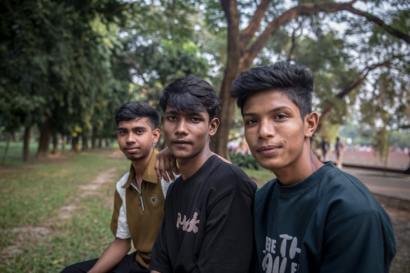 Ariful (16) and Bipul (18) are garment workers in an embroidery factory, while Shahidul (16) works for an 'online' company. Photograph: Sally Hayden