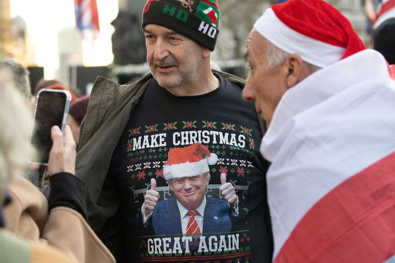 A participant at a Christmas-themed religious gathering in London organised by far-right activist Tommy Robinson. Photograph: Ilyas Tayfun Salci/Anadolu/Getty Images