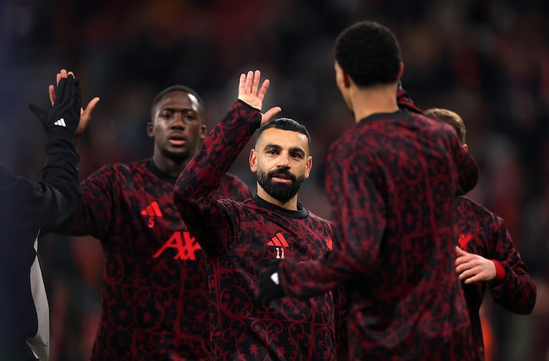 Mohamed Salah of Liverpool interacts with his team-mates. Photograph: Carl Recine/Getty