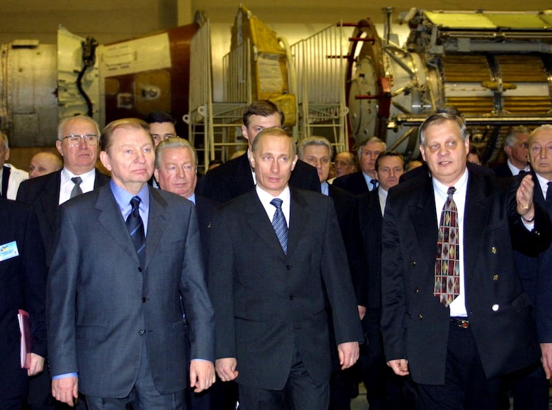 Ukrainian president Leonid Kuchma and his Russian counterpart Vladimir Putin are guided through Yuzhmash missile factory by company director Yuri Alekseev in 2001. Photograph: AFP via Getty Images