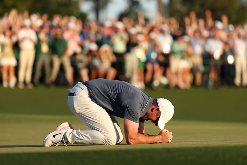 Rory McIlroy reacts to holing the putt that made him just one of six men to have completed golf's Grand Slam. Photograph: Richard Heathcote/Getty Images