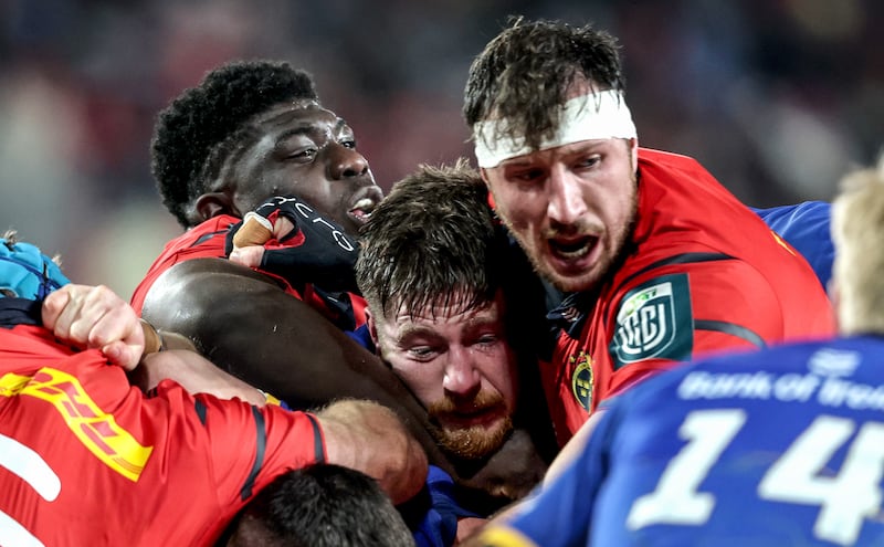 Leinster's Joe McCarthy and Munster's Edwin Edogbo and Tom Ahern. Photograph: Dan Sheridan/Inpho