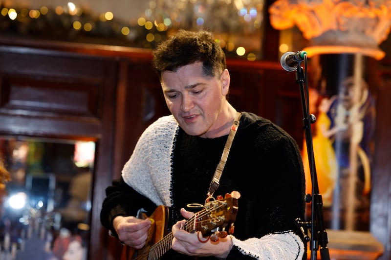 Danny O'Donoghue of The Script takes part in the annual Christmas Eve busk on Grafton Street in Dublin on Wednesday, in aid the Dublin Simon Community. Photograph: Conor Ó Mearáin/PA Wire 