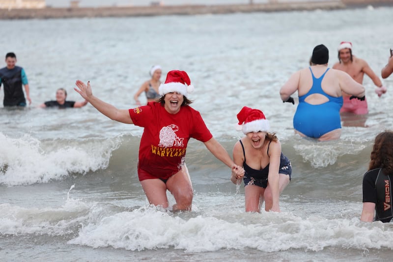 Amy Alperin (left) and Shannon make a splash in Sandtcove. Photograph: Bryan O’Brien
