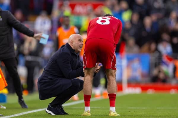 LIVERPOOL, ENGLAND - Saturday, December 13, 2025: Liverpool's head coach Arne Slot gives Dominik Szoboszlai instructions whilst Joe Gomez receives treatment during the FA Premier League match between Liverpool FC and Brighton & Hove Albion FC at Anfield. (Photo by David Rawcliffe/Propaganda)