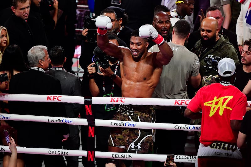 Anthony Joshua celebrates victory after knocking down Jake Paul. Photograph: JC Ruiz/PA