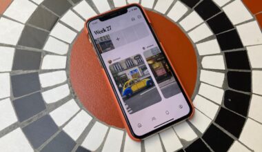 Retro app on a smartphone screen on a smartphone laying on a tiled table