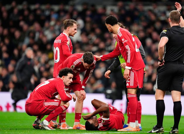 Liverpool hold off late challenge from nine-man Tottenham for dramatic win