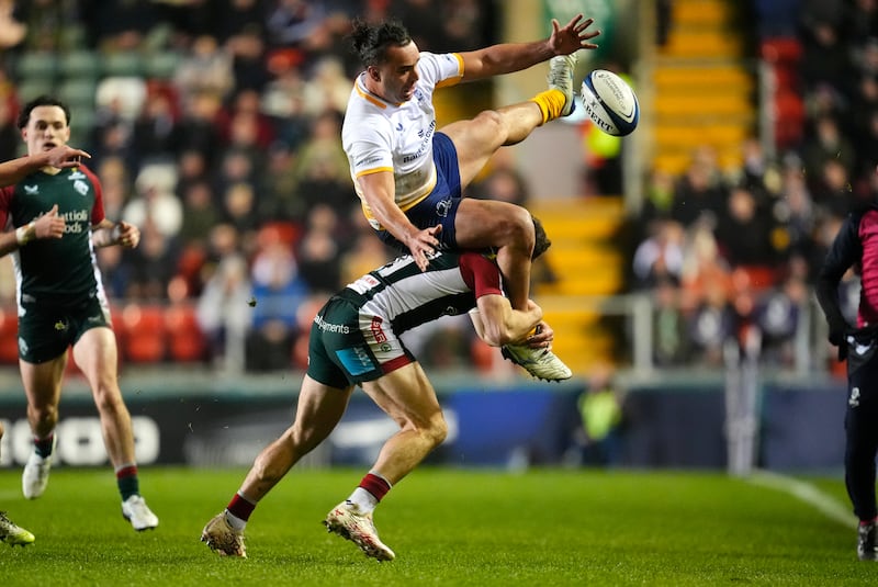 Leinster Rugby's James Lowe is tackled by Leicester Tigers' Adam Radwan. Photograph: Nick Potts/PA