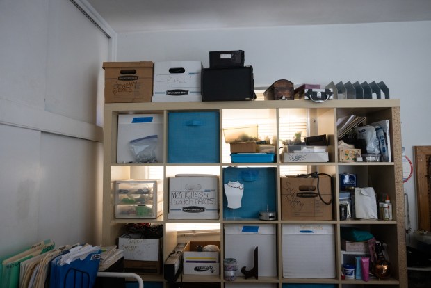 A shelving unit blocks a window to increase security during frequent visits from Jo's son. (Ana Ramirez / The San Diego Union-Tribune)