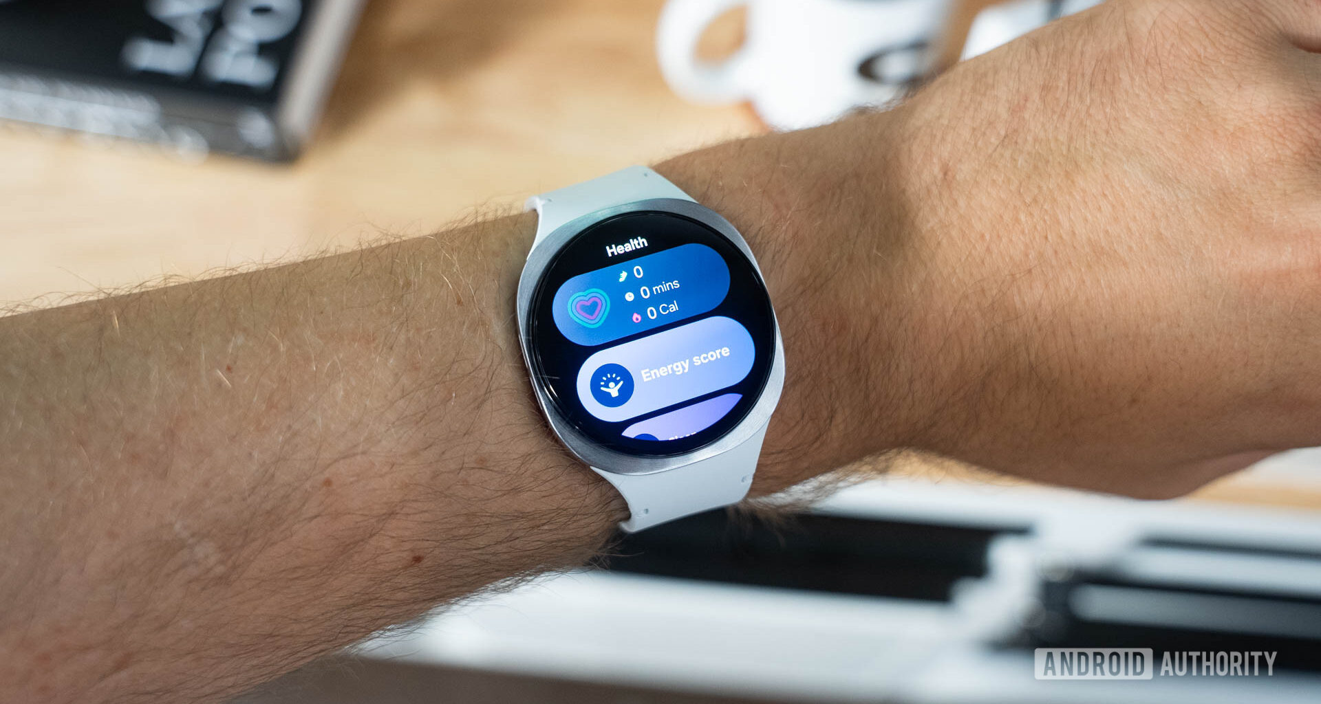 Samsung Galaxy Watch 8 on wrist showing widgets