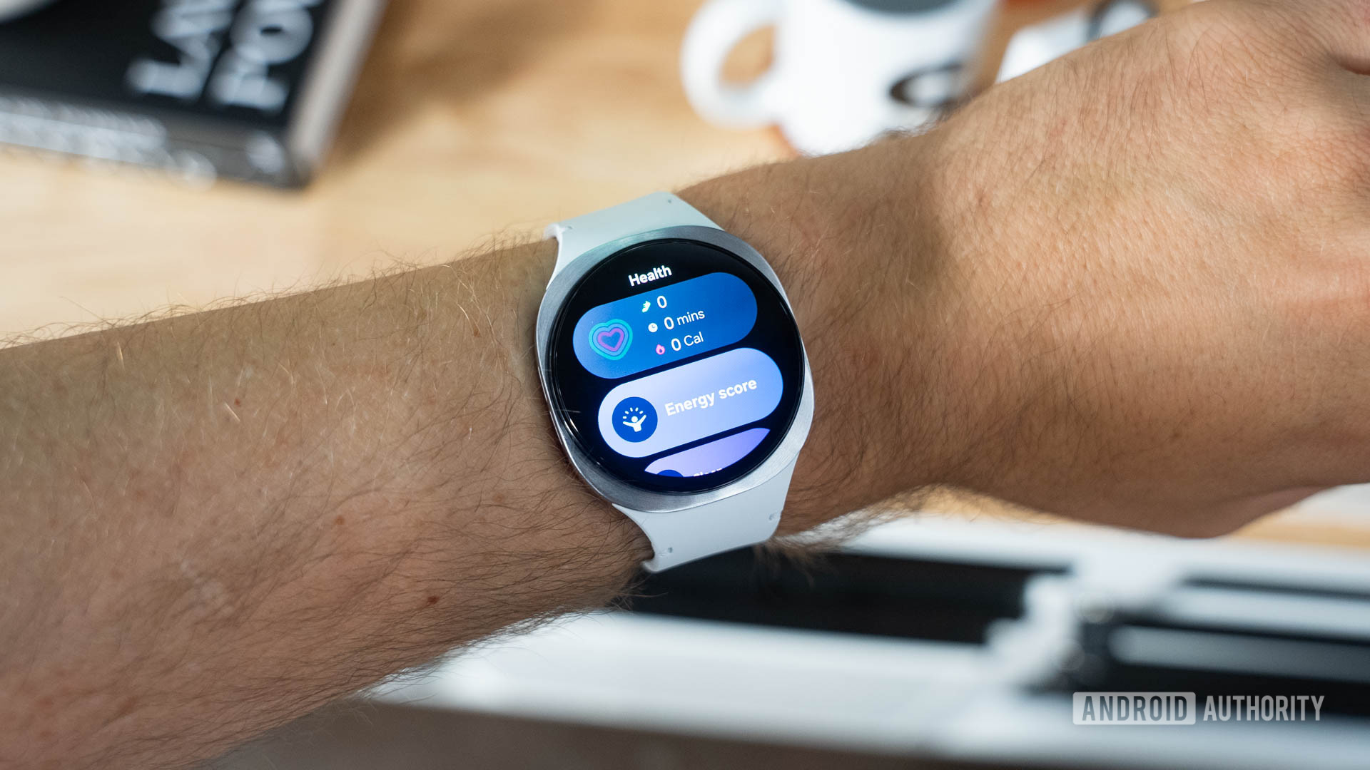 Samsung Galaxy Watch 8 on wrist showing widgets