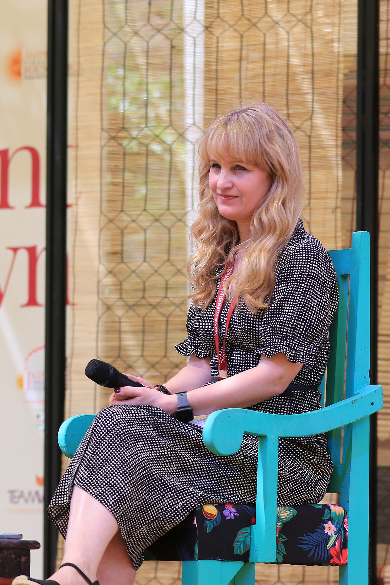 Image may contain Gardi Hutter Person Sitting Blonde Hair Wristwatch Chair Furniture Accessories and Bracelet