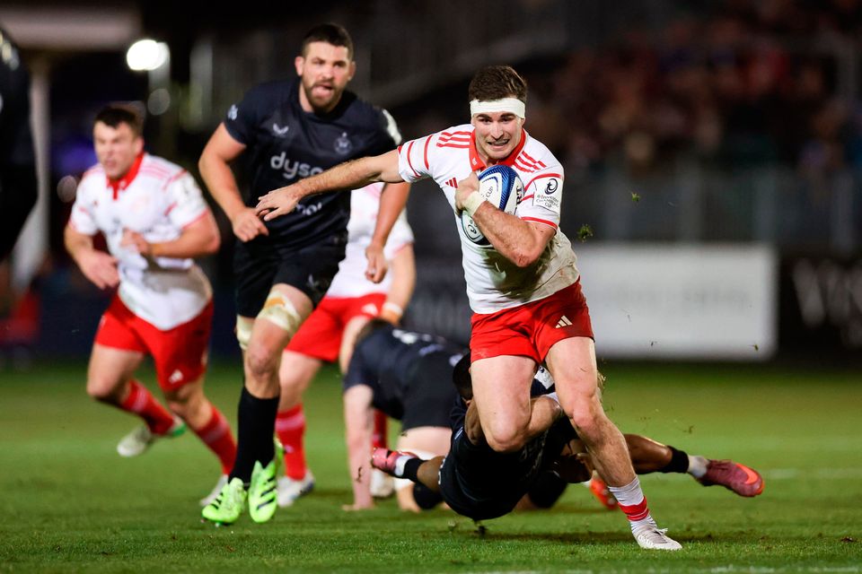 Shane Daly of Munster evades the tackle of Max Ojomoh of Bath during the Champions Cup match at The Recreation Ground in Bath, England. Photo: Harry Murphy/Sportsfile