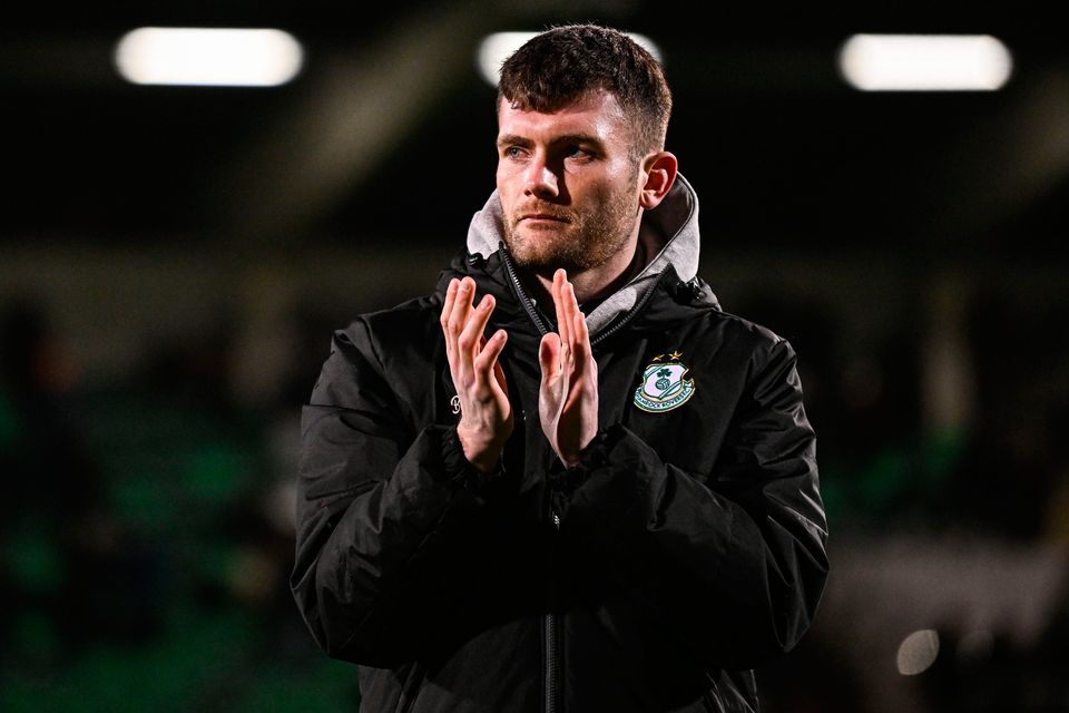 Josh Honohan of Shamrock Rovers is honoured by the crowd at half-time