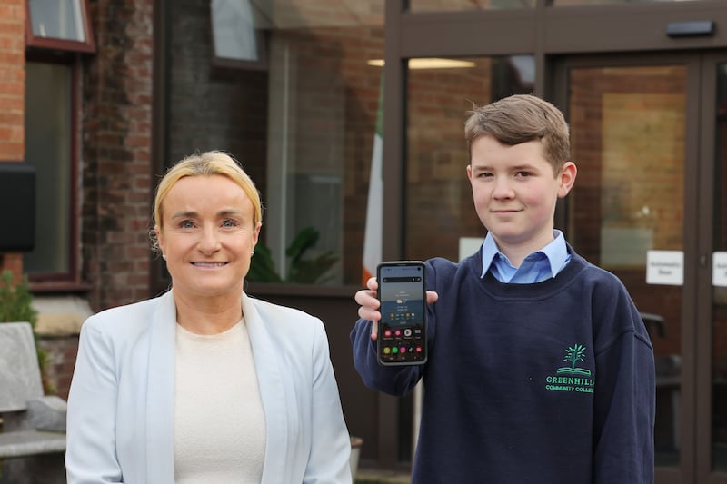 Maria Donoghue, business teacher and Webwise programme co-ordinator at Greenhills  Community College, and third-year student Zach Moore (14). Photograph: Alan Betson 
