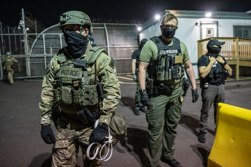 Federal agents guard a gate at an Immigration and Customs Enforcement facility in Newark, New Jersey. On Wednesday, it was confirmed that Ice operations were active in both New Orleans and Minnesota. Photograph: Victor J. Blue/The New York Times
                      