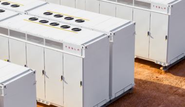 A Tesla Megapack cluster deployed in a desert environment.