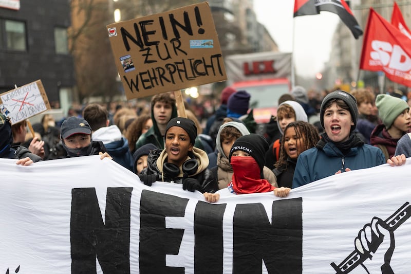 Young protesters hold a banner that reads "No to military conscription" on December 5th in Berlin. Photograph:Maja Hitij/ Getty Images