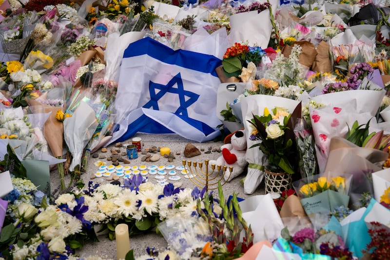 An Israeli flag and flowers are laid outside Bondi Pavilion at Bondi Beach as people gather to mourn in the wake of a mass shooting. Photograph: Audrey Richardson/Getty Images