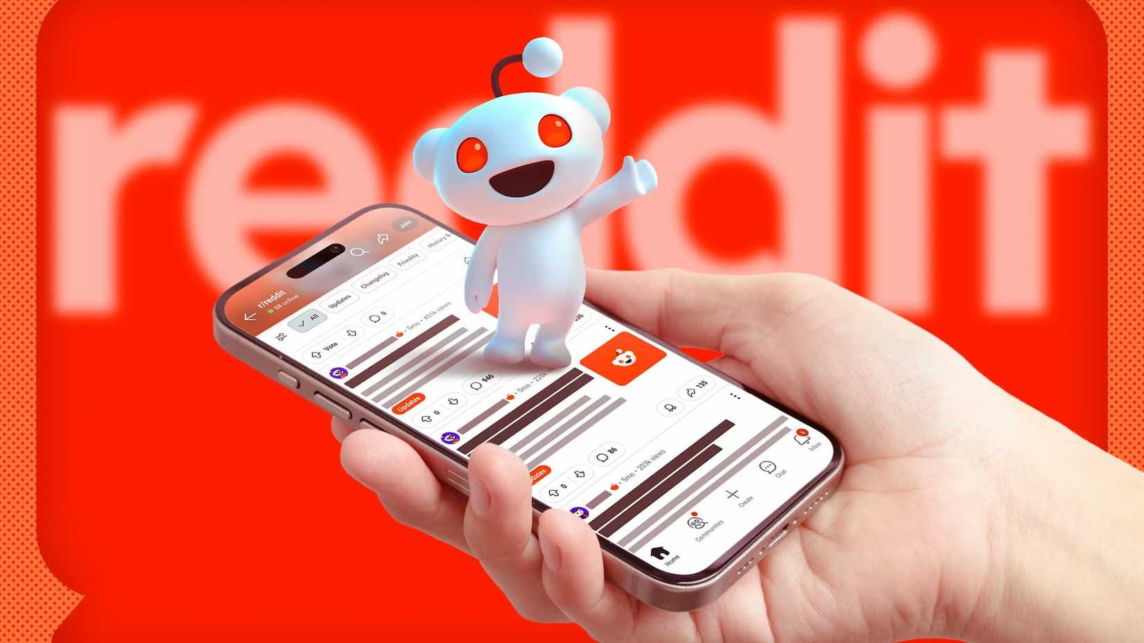A hand holding a phone with Reddit open, the Reddit mascot on the screen, and the logo blurred in the background.