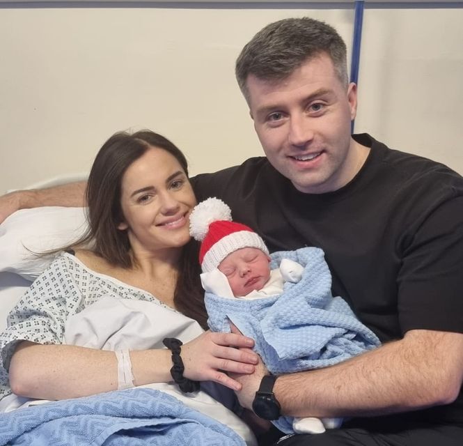 Baby Tommy with new parents Ruth and Gary Kenna