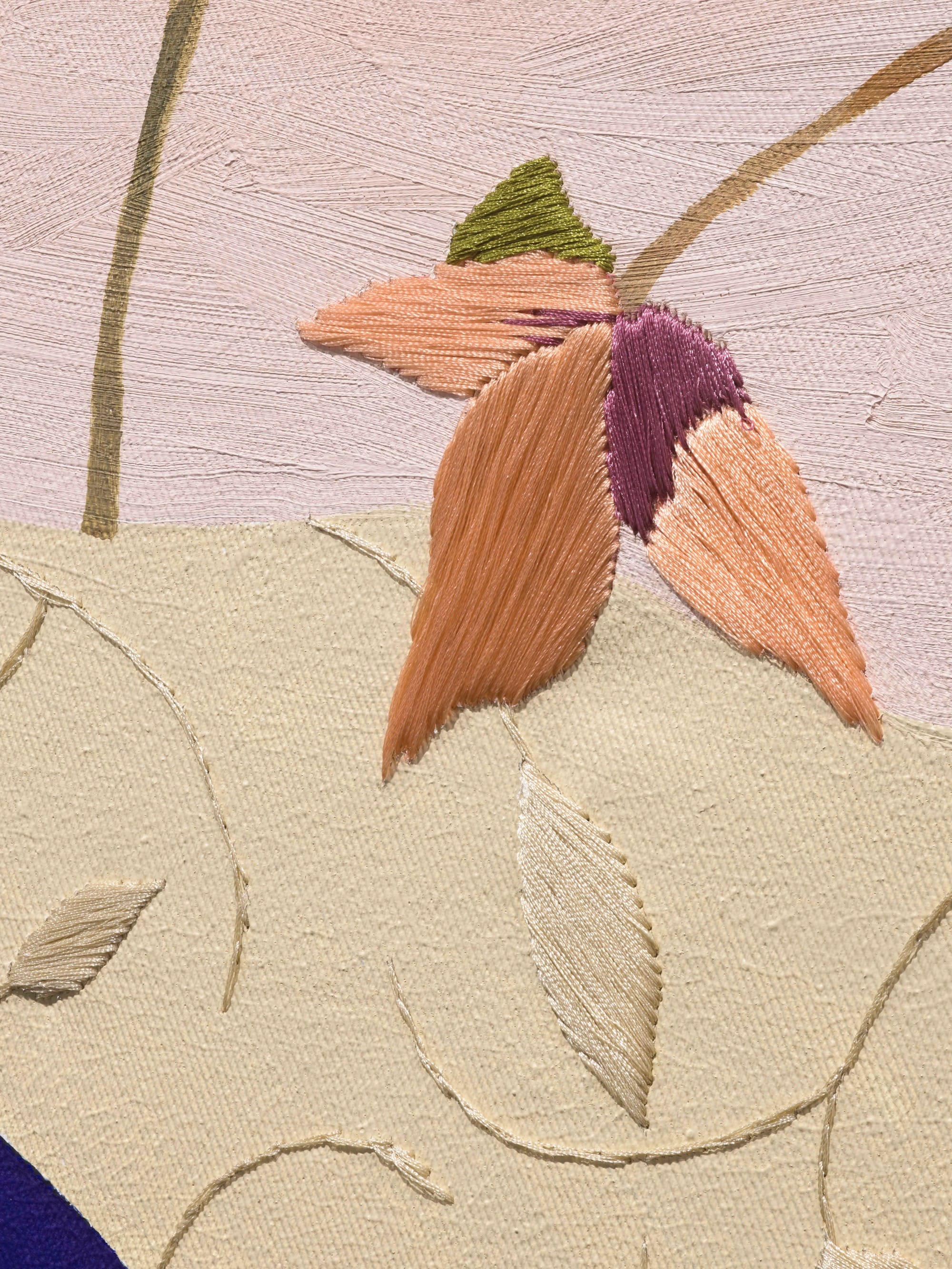 An embroidered floral detail on canvas